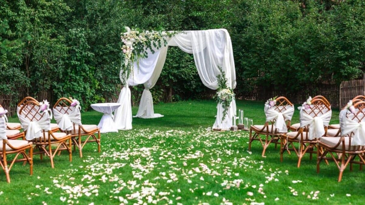 Outdoor Garden Wedding with flower petals aisle runner