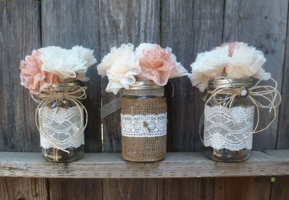 Beautiful White floral arrangement in Twine-wrapped mason jars