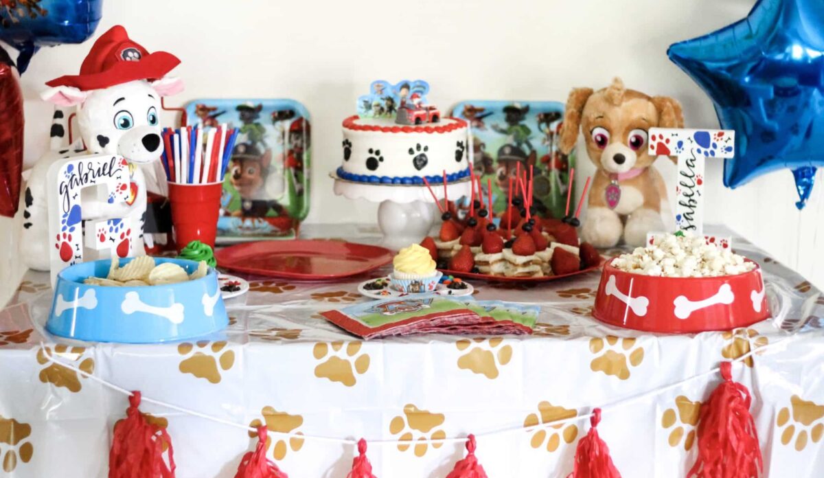 PAW Patrol Table Decor With Colorful balloon Arch and PAW Patrol Character Cutouts