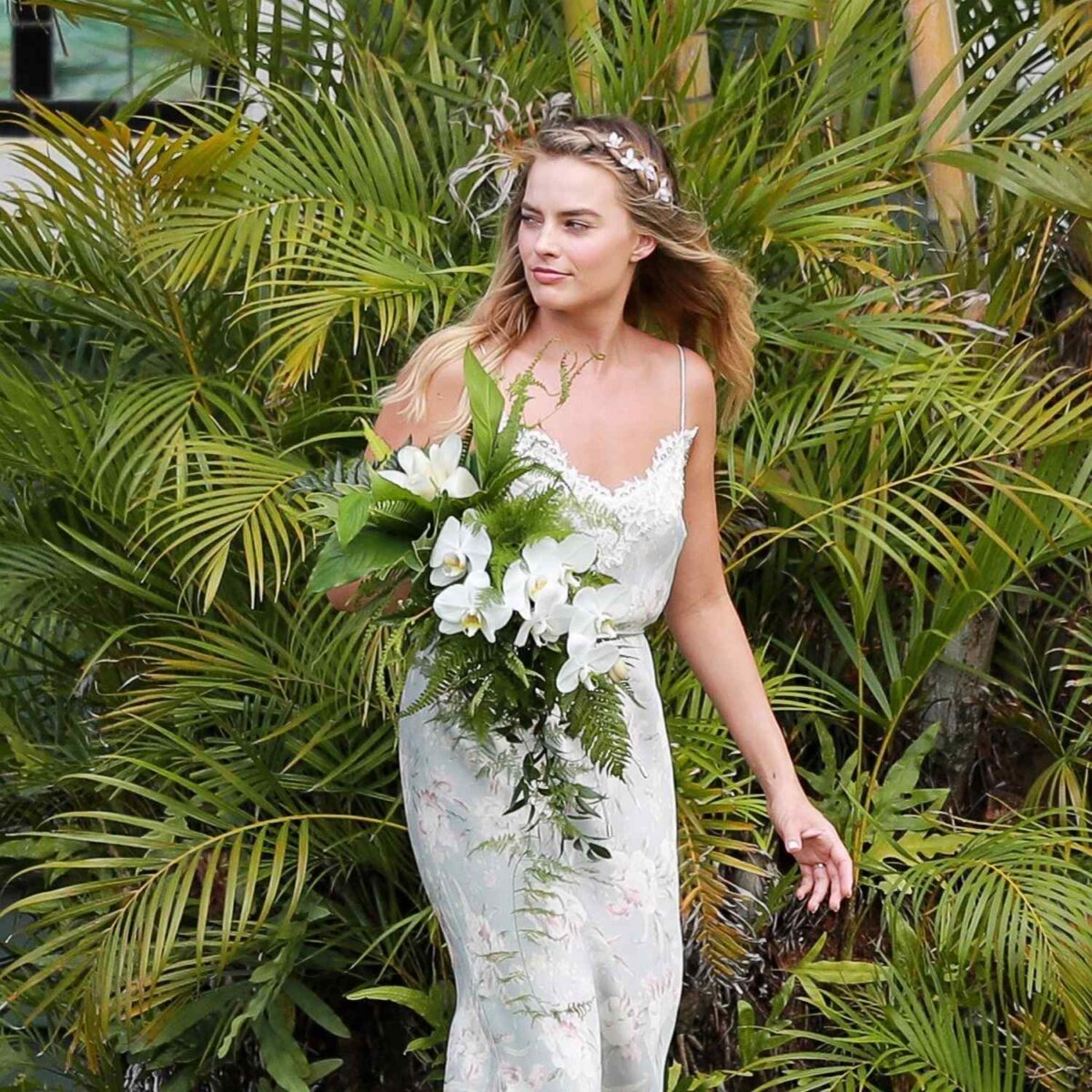 Beautiful Margot Robbie In Her Boho Wedding, Holding Bouquet made of Greenery and white rose flowers