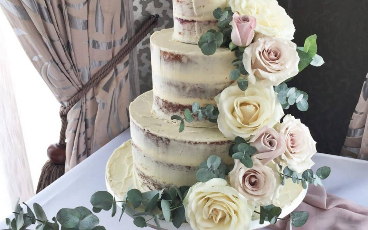 Multi-Tiered Naked Wedding Cake with fresh floral topper