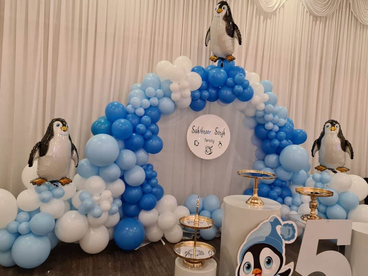 Penguin Birthday Party Decor with Pink and blue balloons