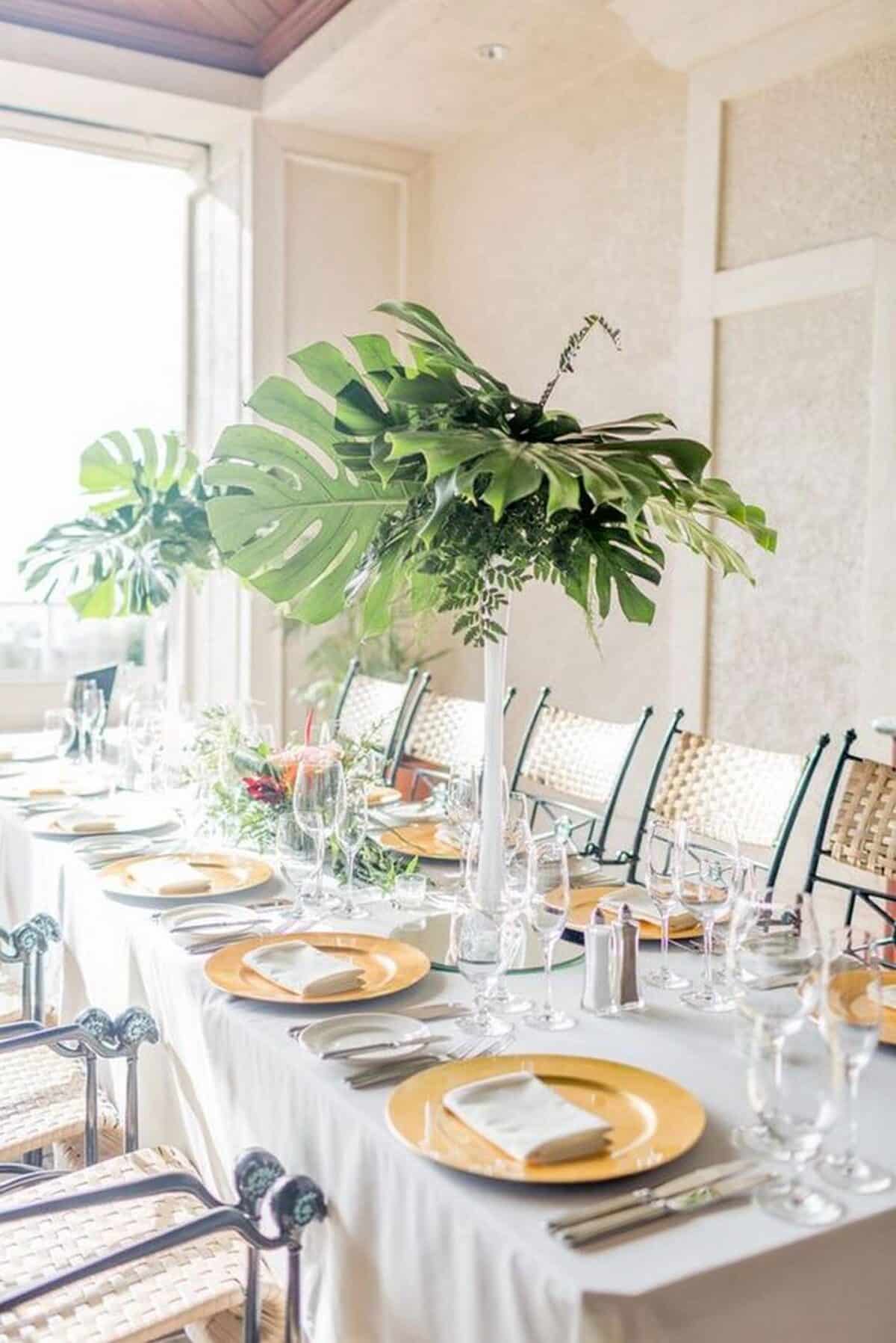 Greenery Monstera and eucalyptus greenery in tall vases