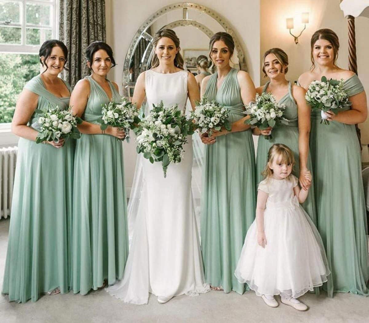 Beautiful Bridesmaids in flowy sage green dresses