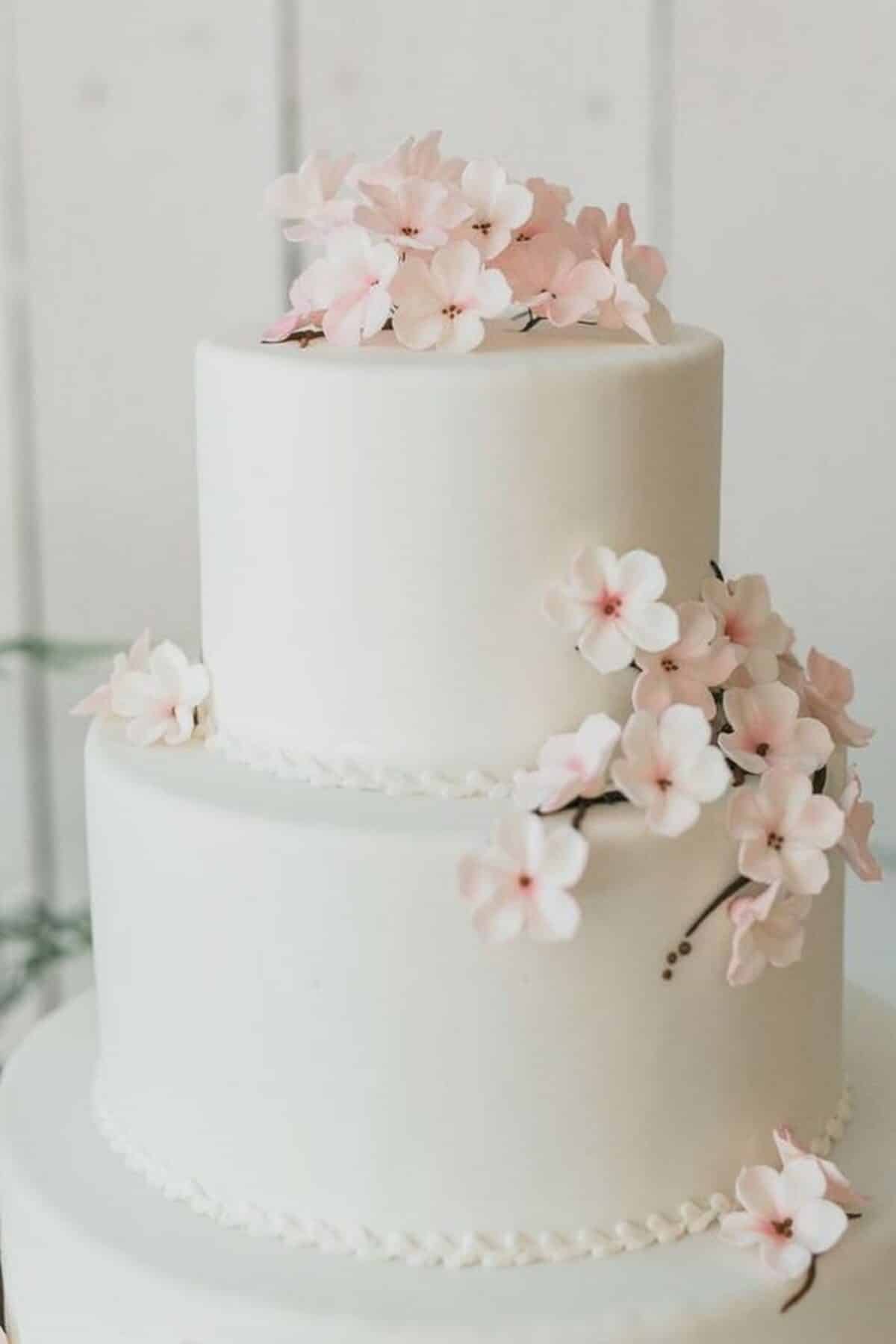 2-Tiered blush wedding cake with edible sakura sugar flowers