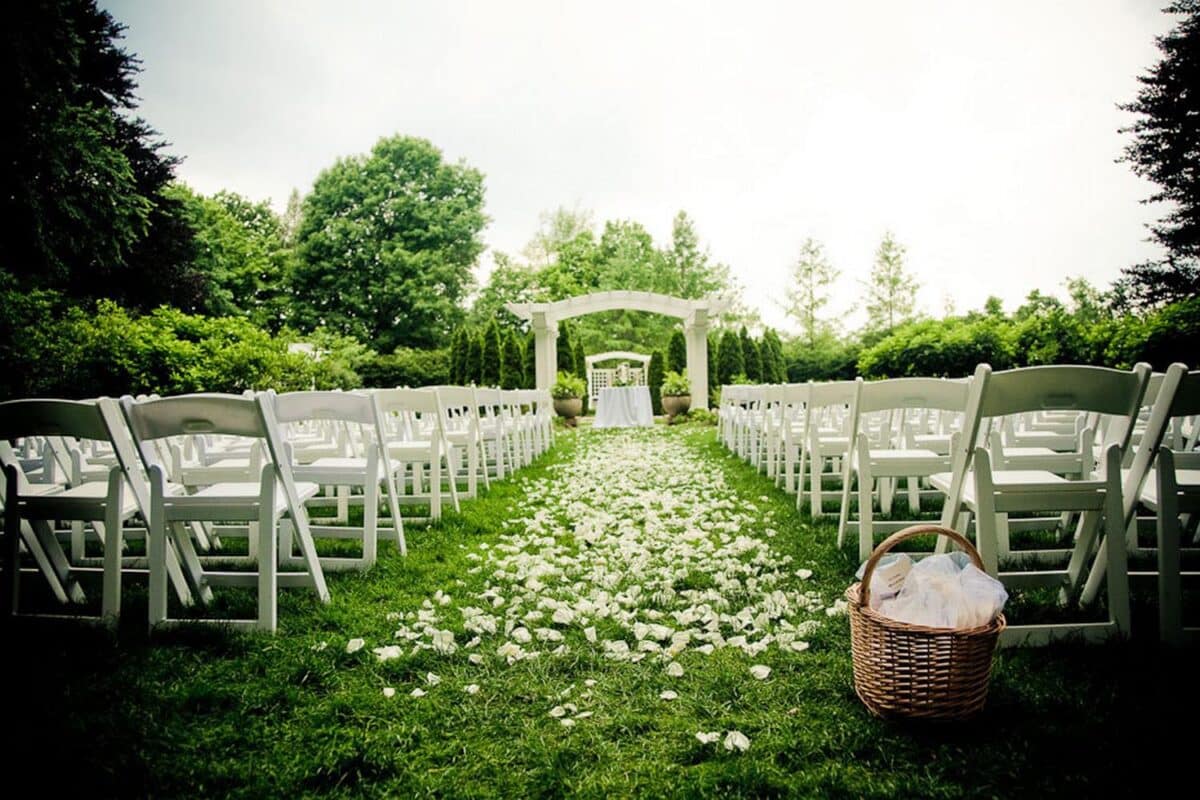 Garden Wedding with rose petals aisle runner