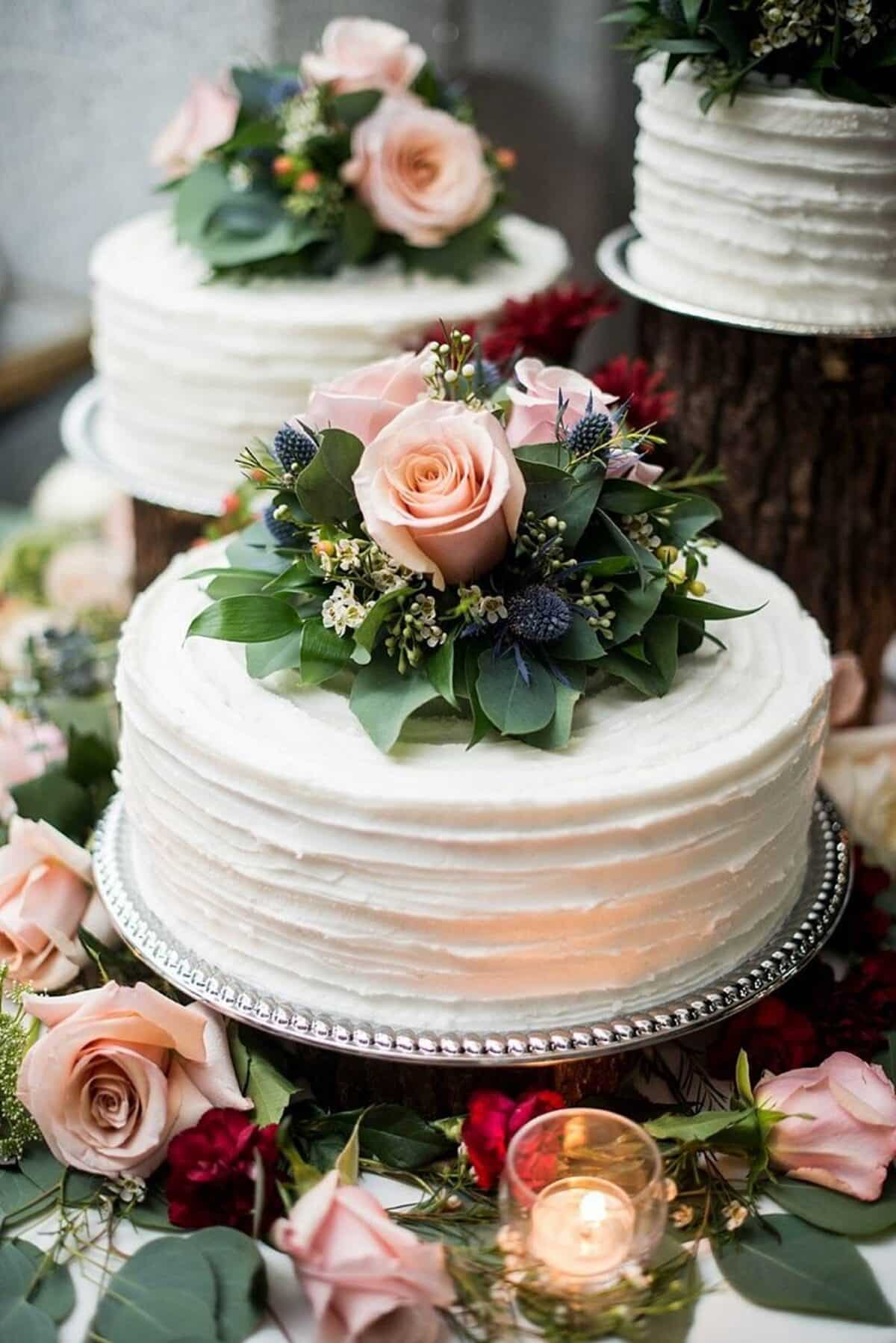 Simple white buttercream Rose Wedding Cake