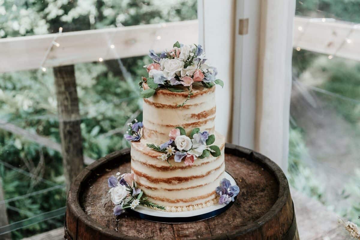 Naked Wedding Cake with floral topper