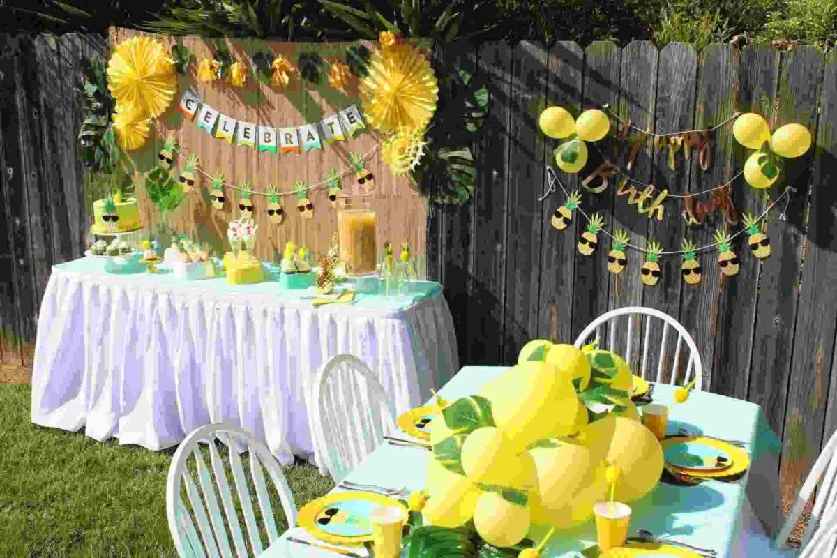 yellow balloon and greenery garland