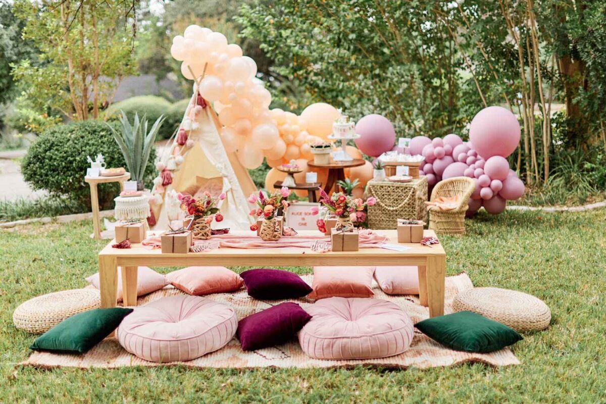 wooden table and boho blanket and pillows