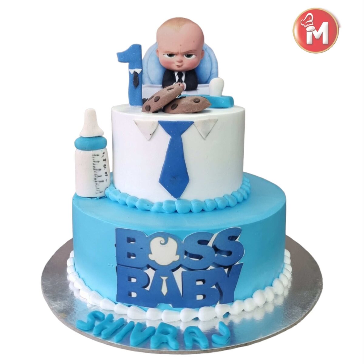 2 tier Boss Baby Cake with two-tone (blue & white) frosting and edible tie and Boss baby fondant topper